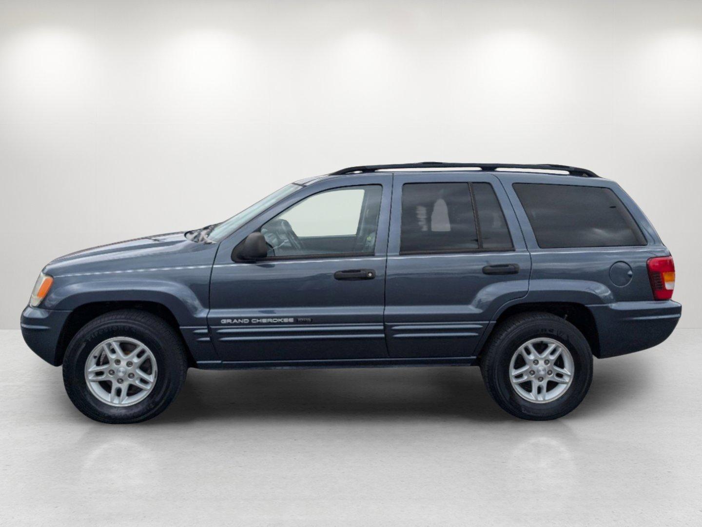 2004 Steel Blue Pearl /Dark Slate Gray Jeep Grand Cherokee Laredo (1J4GX48S34C) with an Gas I6 4.0L/242 engine, 4-Speed Automatic w/OD transmission, located at 1430 Gateway Drive, Opelika, AL, 36801, (334) 239-0944, 32.637871, -85.409790 - 2004 Jeep Grand Cherokee Laredo - Photo#7