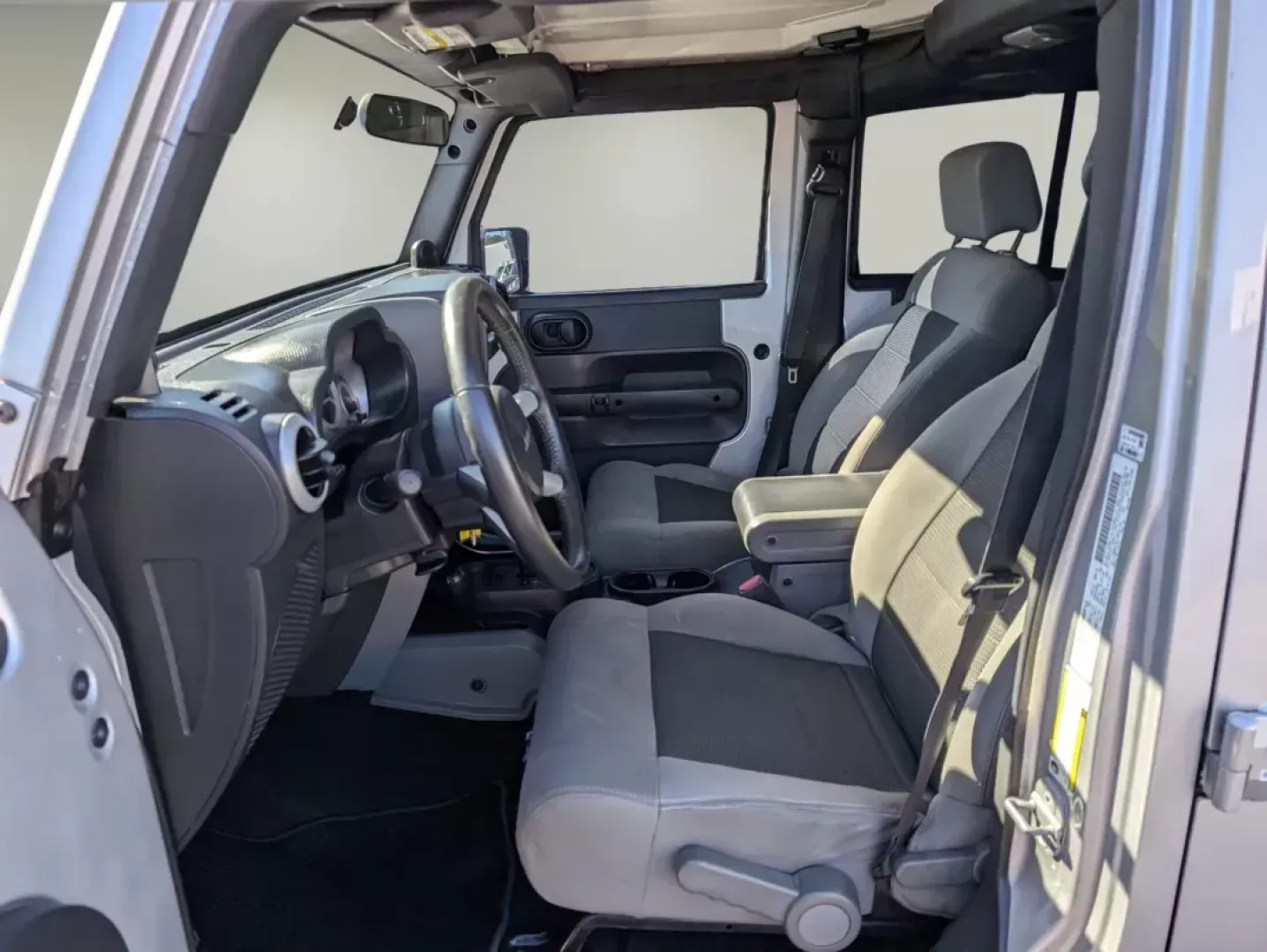 2010 /Dark Slate Gray/Medium Slate Gray Jeep Wrangler Unlimited Sahara (1J4BA5H13AL) with an Gas V6 3.8L/231 engine, 4-Speed Automatic transmission, located at 3959 U.S. 80 W, Phenix City, AL, 36870, (334) 297-4885, 32.469296, -85.135185 - 2010 Jeep Wrangler Unlimited Sahara - Photo#9