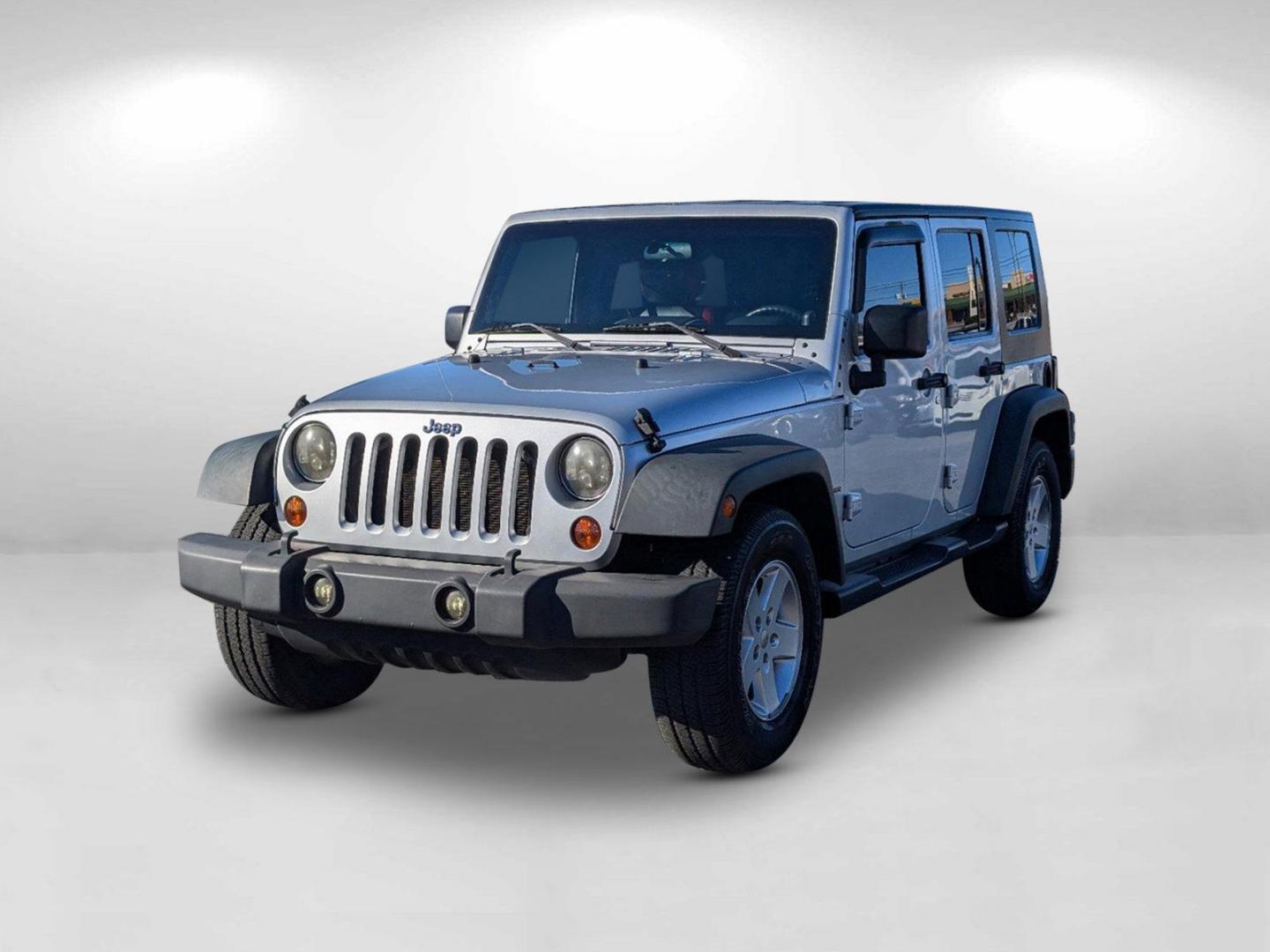 2010 /Dark Slate Gray/Medium Slate Gray Jeep Wrangler Unlimited Sport (1J4BB3H13AL) with an Gas V6 3.8L/231 engine, 4-Speed Automatic transmission, located at 1430 Gateway Drive, Opelika, AL, 36801, (334) 239-0944, 32.637871, -85.409790 - 2010 Jeep Wrangler Unlimited Sport - Photo#1