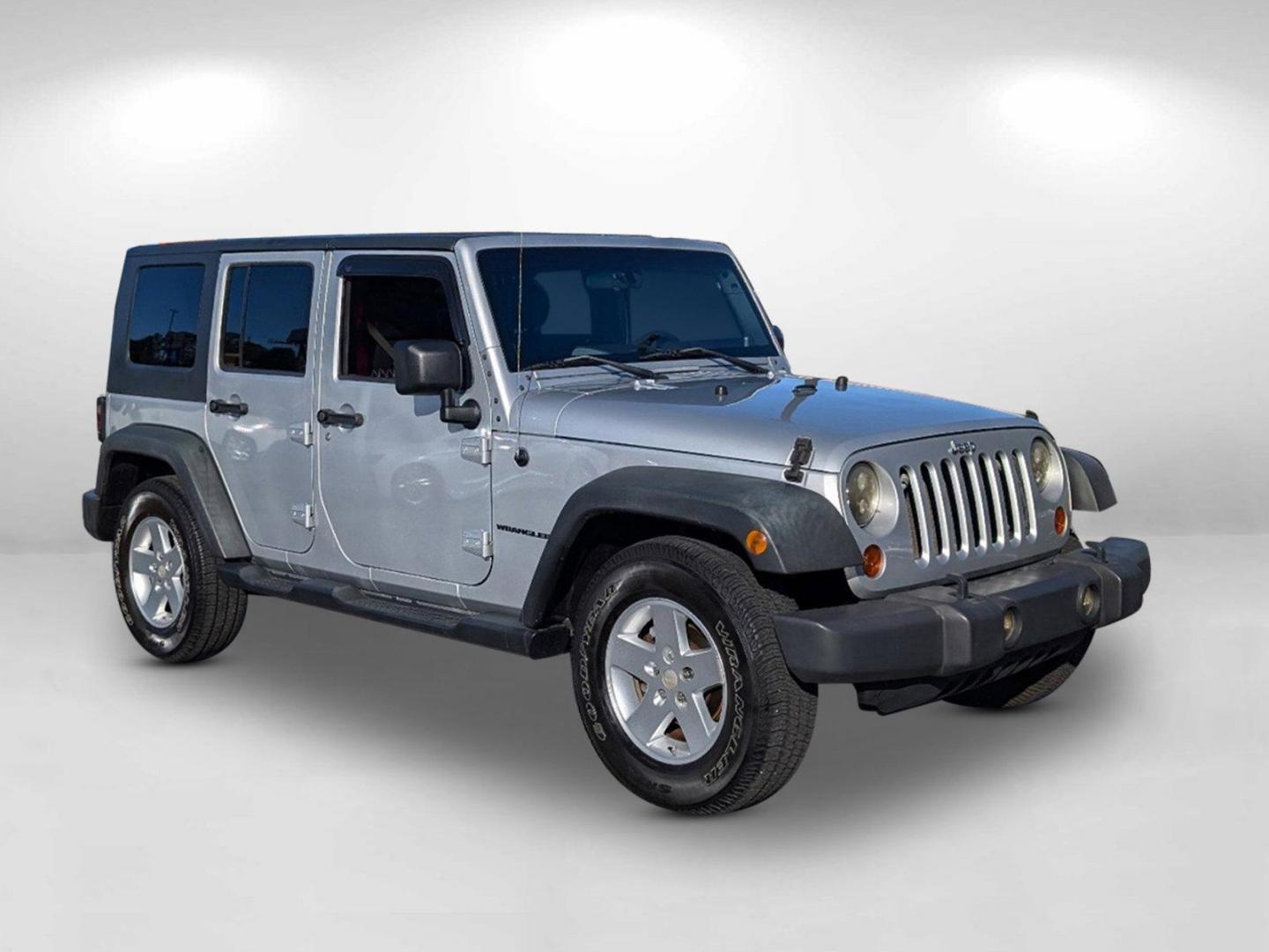 2010 /Dark Slate Gray/Medium Slate Gray Jeep Wrangler Unlimited Sport (1J4BB3H13AL) with an Gas V6 3.8L/231 engine, 4-Speed Automatic transmission, located at 1430 Gateway Drive, Opelika, AL, 36801, (334) 239-0944, 32.637871, -85.409790 - 2010 Jeep Wrangler Unlimited Sport - Photo#4