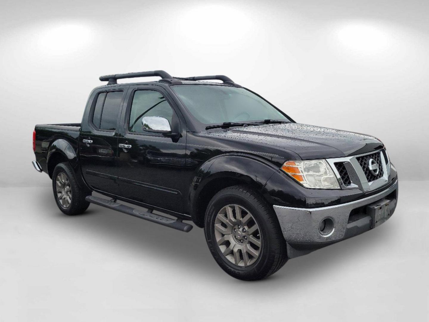 2010 Super Black /Graphite Nissan Frontier LE (1N6AD0ER7AC) with an Gas V6 4.0L/ engine, 5-Speed Automatic w/OD transmission, located at 1430 Gateway Drive, Opelika, AL, 36801, (334) 239-0944, 32.637871, -85.409790 - 2010 Nissan Frontier LE - Photo#2