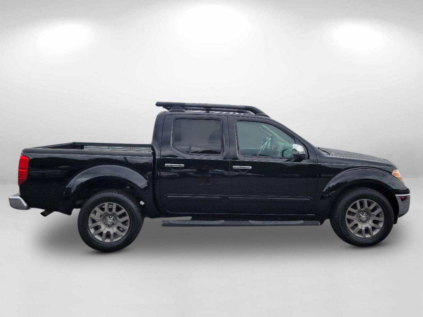 2010 Super Black /Graphite Nissan Frontier LE (1N6AD0ER7AC) with an Gas V6 4.0L/ engine, 5-Speed Automatic w/OD transmission, located at 1430 Gateway Drive, Opelika, AL, 36801, (334) 239-0944, 32.637871, -85.409790 - 2010 Nissan Frontier LE - Photo#3