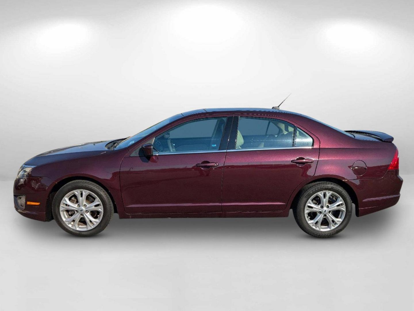 2012 Maroon Ford Fusion SE (3FAHP0HA0CR) with an Gas I4 2.5L/152 engine, 6-Speed Automatic transmission, located at 804 22nd Ave, Phenix City, AL, 36870, (334) 297-1860, 32.484749, -85.024475 - 2012 Ford Fusion SE - Photo#7