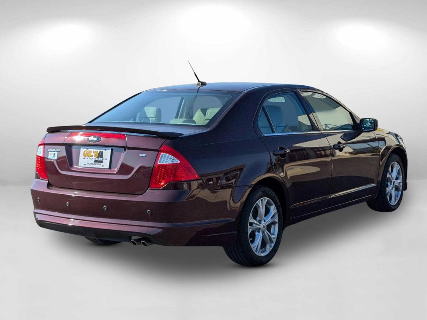 2012 Maroon Ford Fusion SE (3FAHP0HA0CR) with an Gas I4 2.5L/152 engine, 6-Speed Automatic transmission, located at 804 22nd Ave, Phenix City, AL, 36870, (334) 297-1860, 32.484749, -85.024475 - 2012 Ford Fusion SE - Photo#4