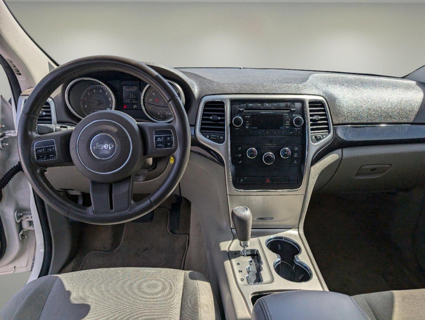 2012 Stone White /Dark Graystone/Medium Graystone Jeep Grand Cherokee Laredo (1C4RJFAG1CC) with an Gas/Ethanol V6 3.6L/220 engine, 5-Speed Automatic transmission, located at 804 22nd Ave, Phenix City, AL, 36870, (334) 297-1860, 32.484749, -85.024475 - 2012 Jeep Grand Cherokee Laredo - Photo#11