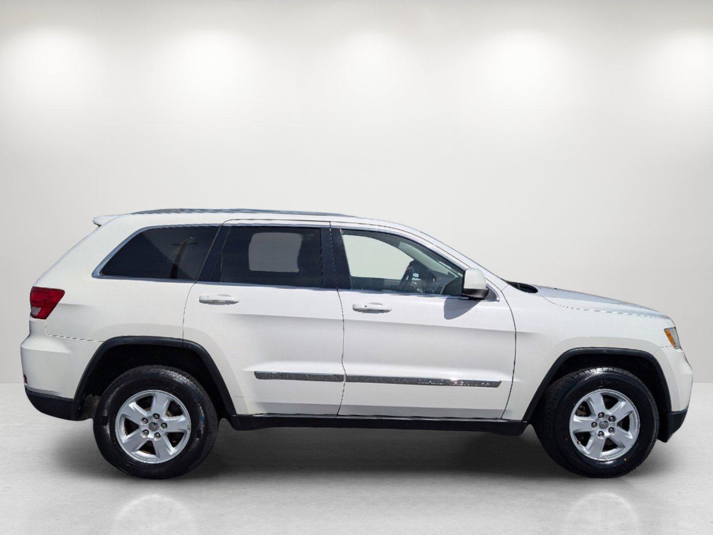 2012 Stone White /Dark Graystone/Medium Graystone Jeep Grand Cherokee Laredo (1C4RJFAG1CC) with an Gas/Ethanol V6 3.6L/220 engine, 5-Speed Automatic transmission, located at 804 22nd Ave, Phenix City, AL, 36870, (334) 297-1860, 32.484749, -85.024475 - 2012 Jeep Grand Cherokee Laredo - Photo#3