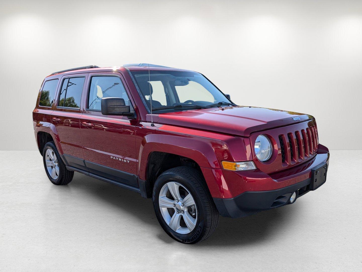2014 /Dark Slate Gray Jeep Patriot Latitude (1C4NJRFB0ED) with an Regular Unleaded I-4 2.4 L/144 engine, 6-Speed Automatic w/OD transmission, located at 1430 Gateway Drive, Opelika, AL, 36801, (334) 239-0944, 32.637871, -85.409790 - 2014 Jeep Patriot Latitude - Photo#2