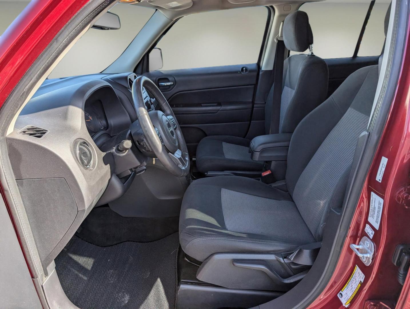 2014 /Dark Slate Gray Jeep Patriot Latitude (1C4NJRFB0ED) with an Regular Unleaded I-4 2.4 L/144 engine, 6-Speed Automatic w/OD transmission, located at 1430 Gateway Drive, Opelika, AL, 36801, (334) 239-0944, 32.637871, -85.409790 - 2014 Jeep Patriot Latitude - Photo#9