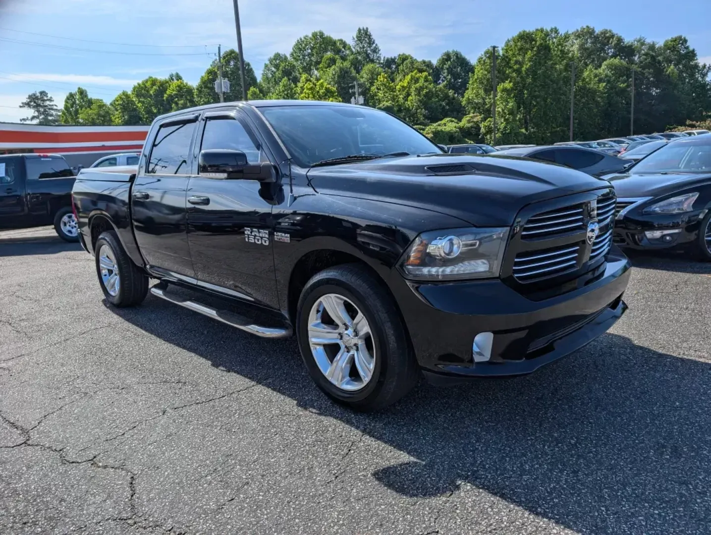 2014 /Black Ram 1500 Sport (1C6RR6MTXES) with an Regular Unleaded V-8 5.7 L/345 engine, 8-Speed Automatic w/OD transmission, located at 3959 U.S. 80 W, Phenix City, AL, 36870, (334) 297-4885, 32.469296, -85.135185 - 2014 Ram 1500 Sport - Photo#2