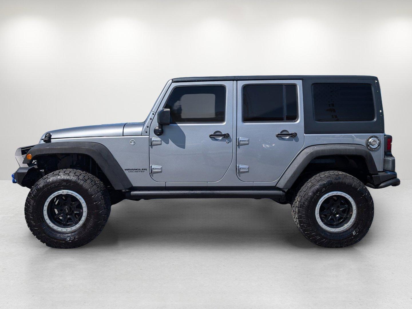 2017 /Black Jeep Wrangler Unlimited Willys Wheeler (1C4BJWDG1HL) with an Regular Unleaded V-6 3.6 L/220 engine, 5-Speed Automatic w/OD transmission, located at 1430 Gateway Drive, Opelika, AL, 36801, (334) 239-0944, 32.637871, -85.409790 - 2017 Jeep Wrangler Unlimited Willys Wheeler - Photo#7